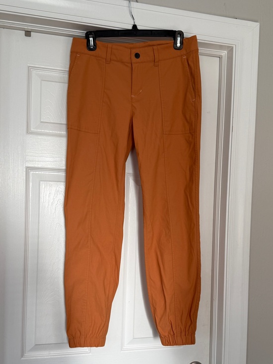 Stio Pants - Women’s performance trail pants in Orange
